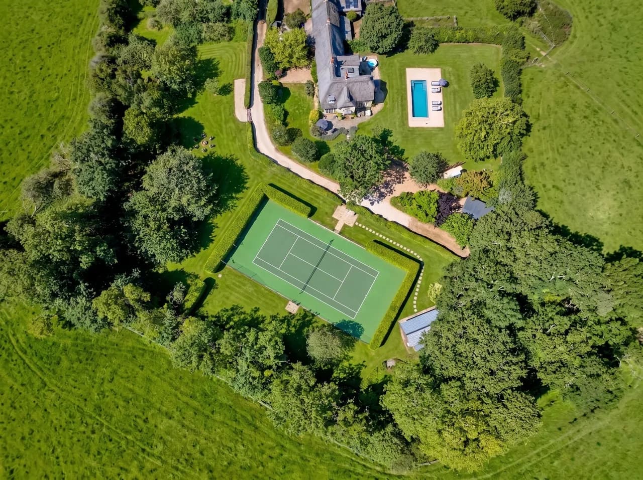 Outdoor pool and spa facilities at a luxury Cotswolds estate